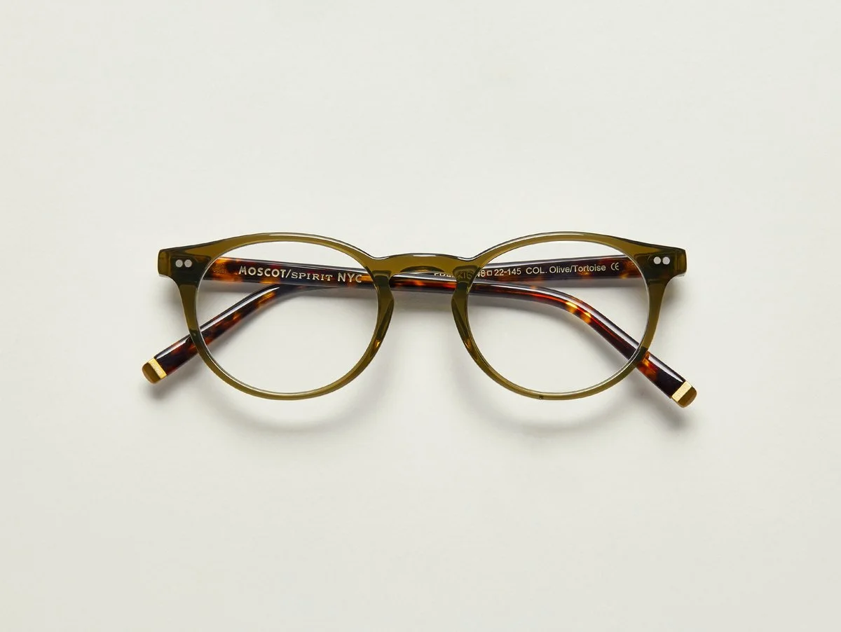 MOSCOT - Frankie Opticals £245 (Sold out) COLOUR Olive/Tortoise SIZE 45 With subtle clean lines, and a full-vue shape, The FRANKIE is the epitome of cool, just like our own Frank, aka, Frankie, who has manned the MOSCOT counter for over 40 years and counting. An iconic frame for an iconic man...and a true MOSCOT character. Handcrafted using Italian acetate featuring unique patterns distinctive to each frame Features two dot rivets Comfortable key hole nose bridge Includes acetate nose pads 3-Barrel hinge MOSCOT temple engravings Signature brass temple tips for MOSCOT SPIRIT frames