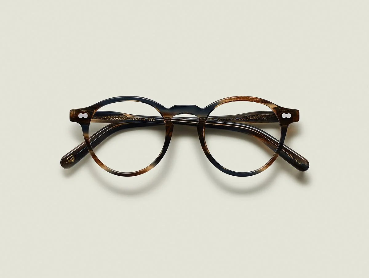 MOSCOT - Militzen Opticals £245 COLOUR Bark SIZE 46 The round, full-vue MILTZEN, first introduced in the 1930s, is eponymously named for our Uncle Heshy, who inexplicably everyone called Uncle Miltzen. And it stuck. So there you go, world... The MILTZEN. Handcrafted using Italian acetate Features adjoined dot rivets Comfortable key hole nose bridge Includes acetate nose pads 3-Barrel hinge MOSCOT temple engravings