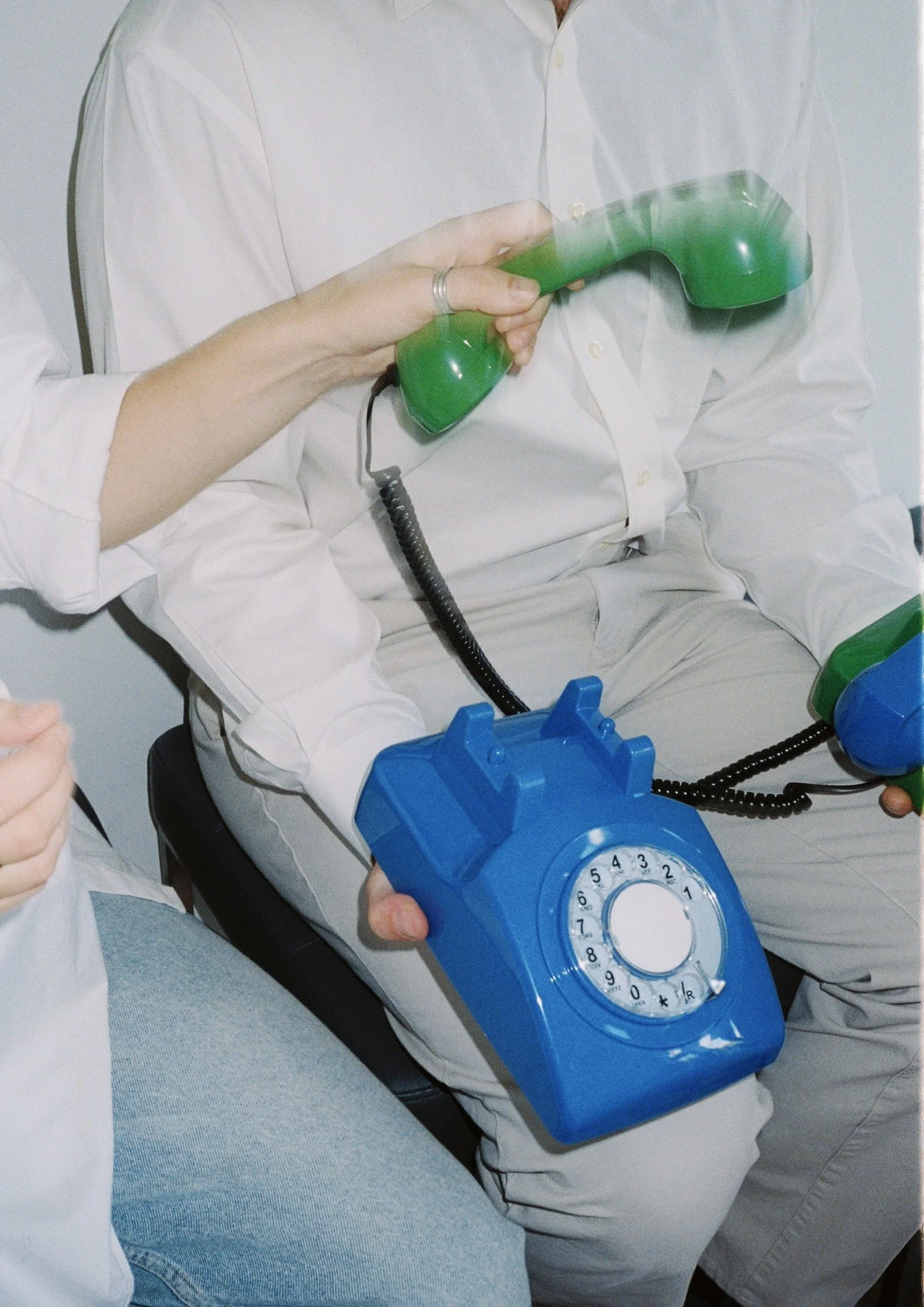 Person using a green phone in a light, relaxed setting, used as a playful visual alongside honest guidance messaging.