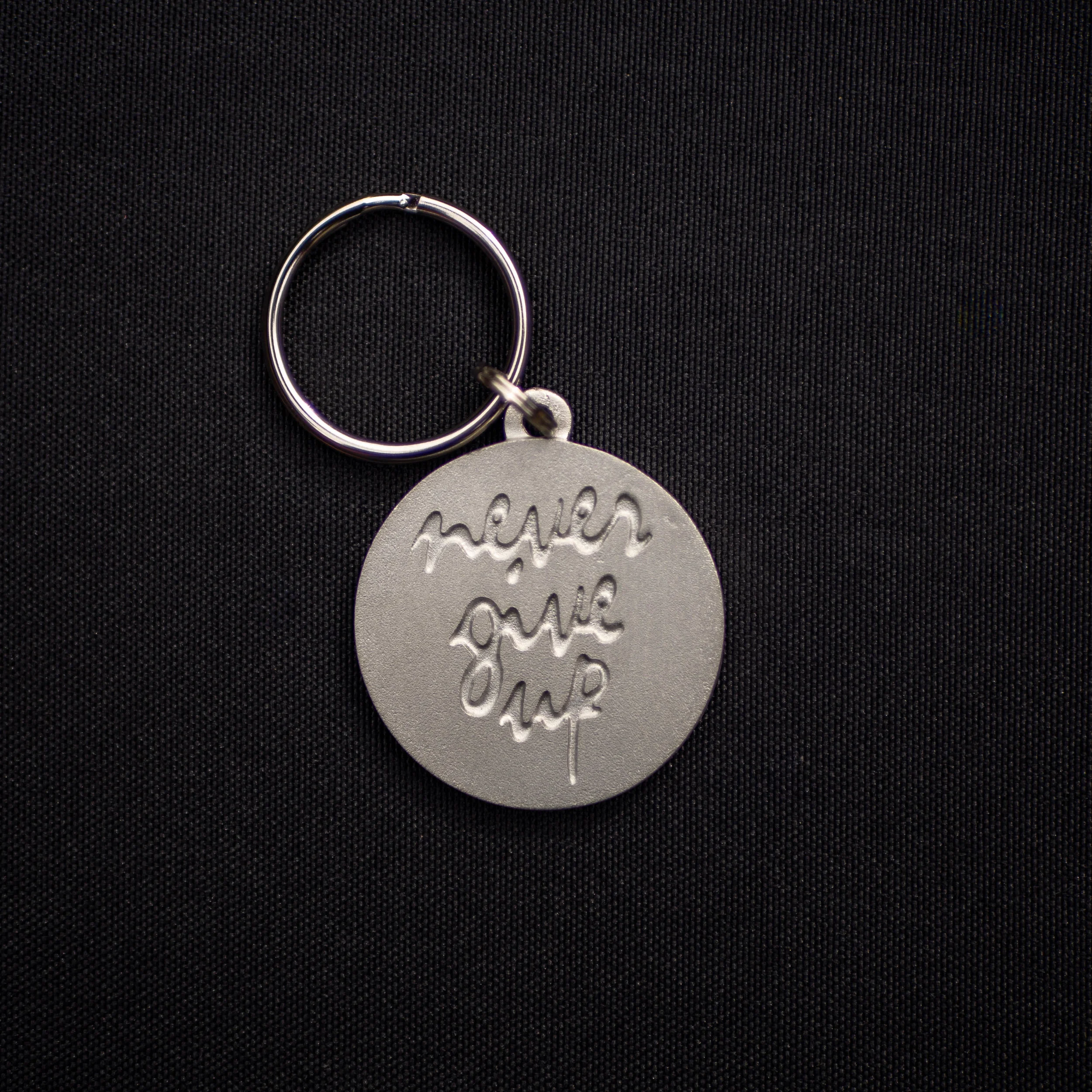 "Never Give Up" Pewter Keychain