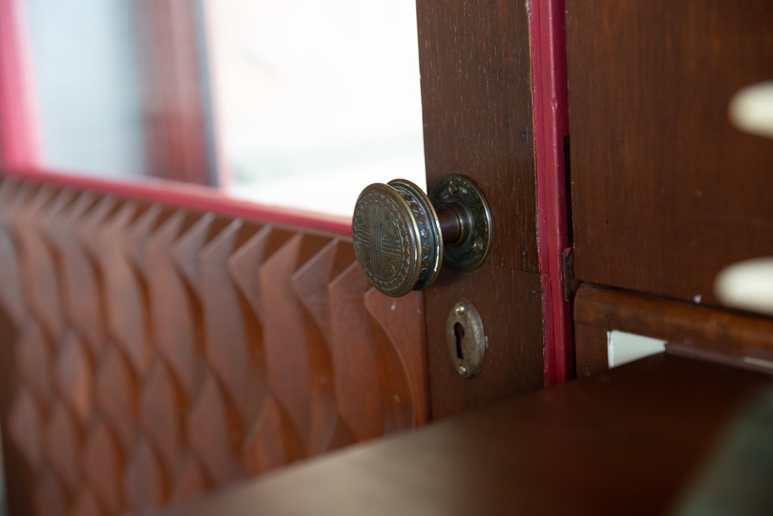 One of three original doors with its painted red details