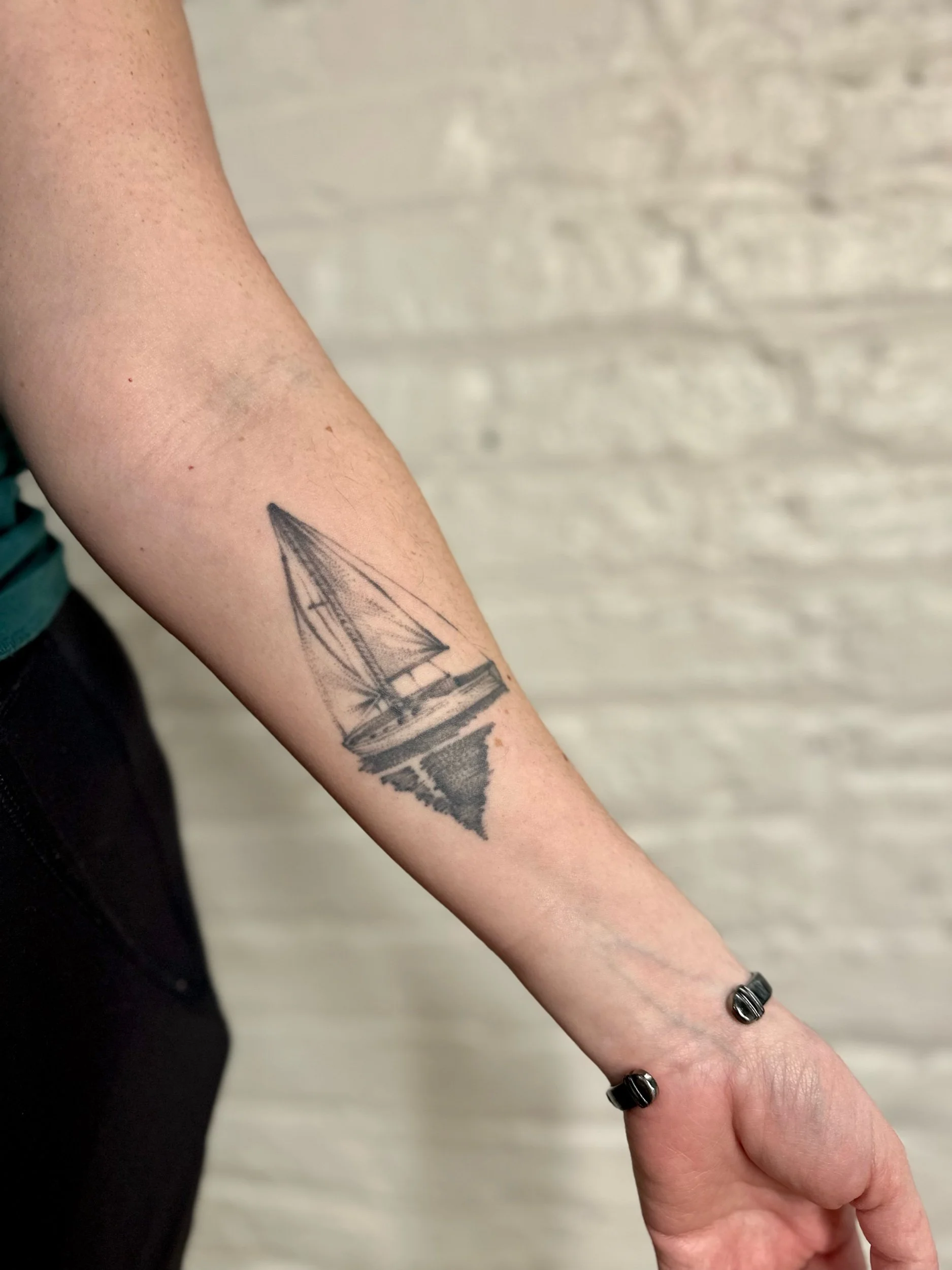 Healed Sailboat Tattoo