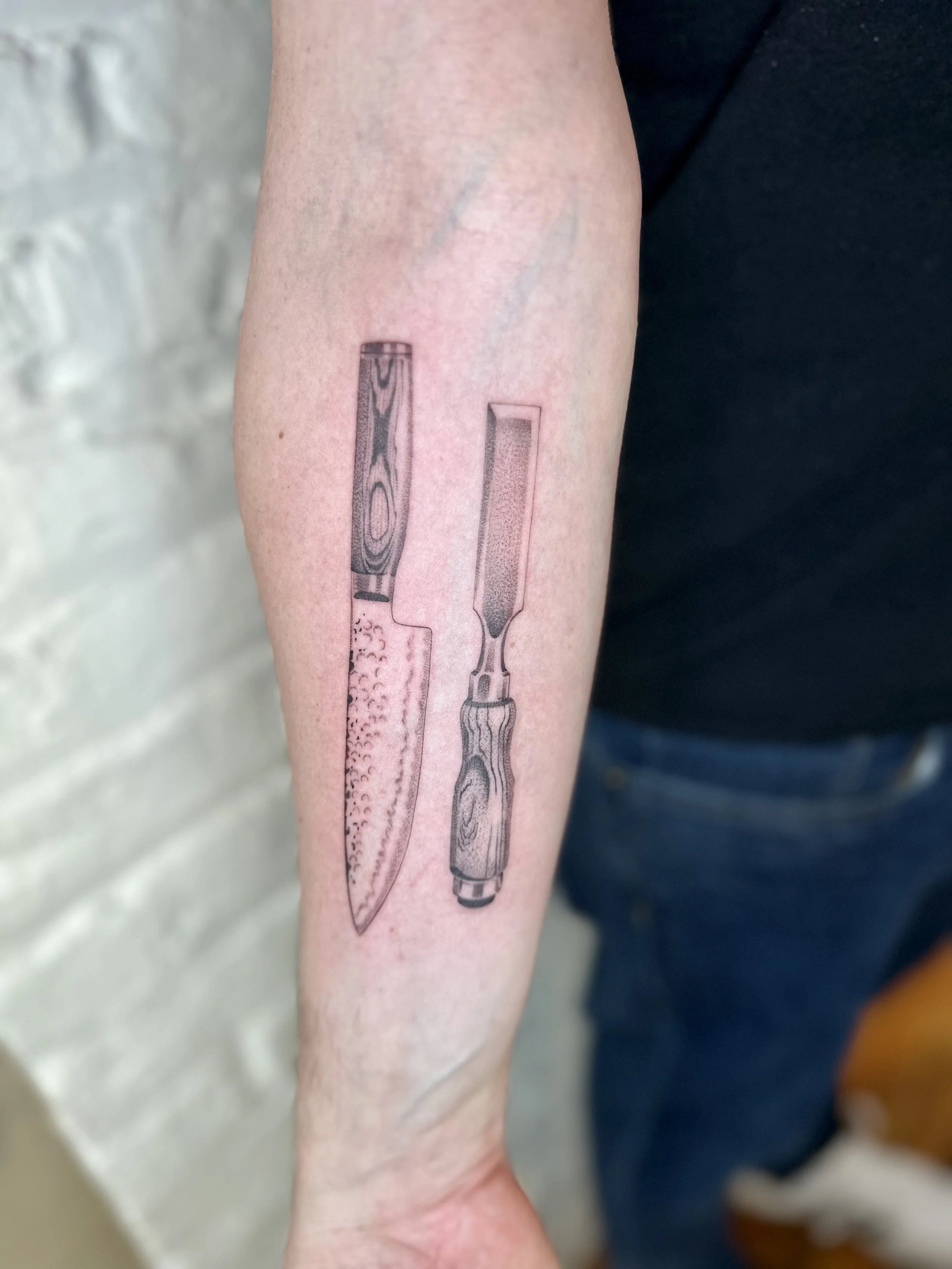 Fine Line Black and Grey Knife and Chisel Tattoo