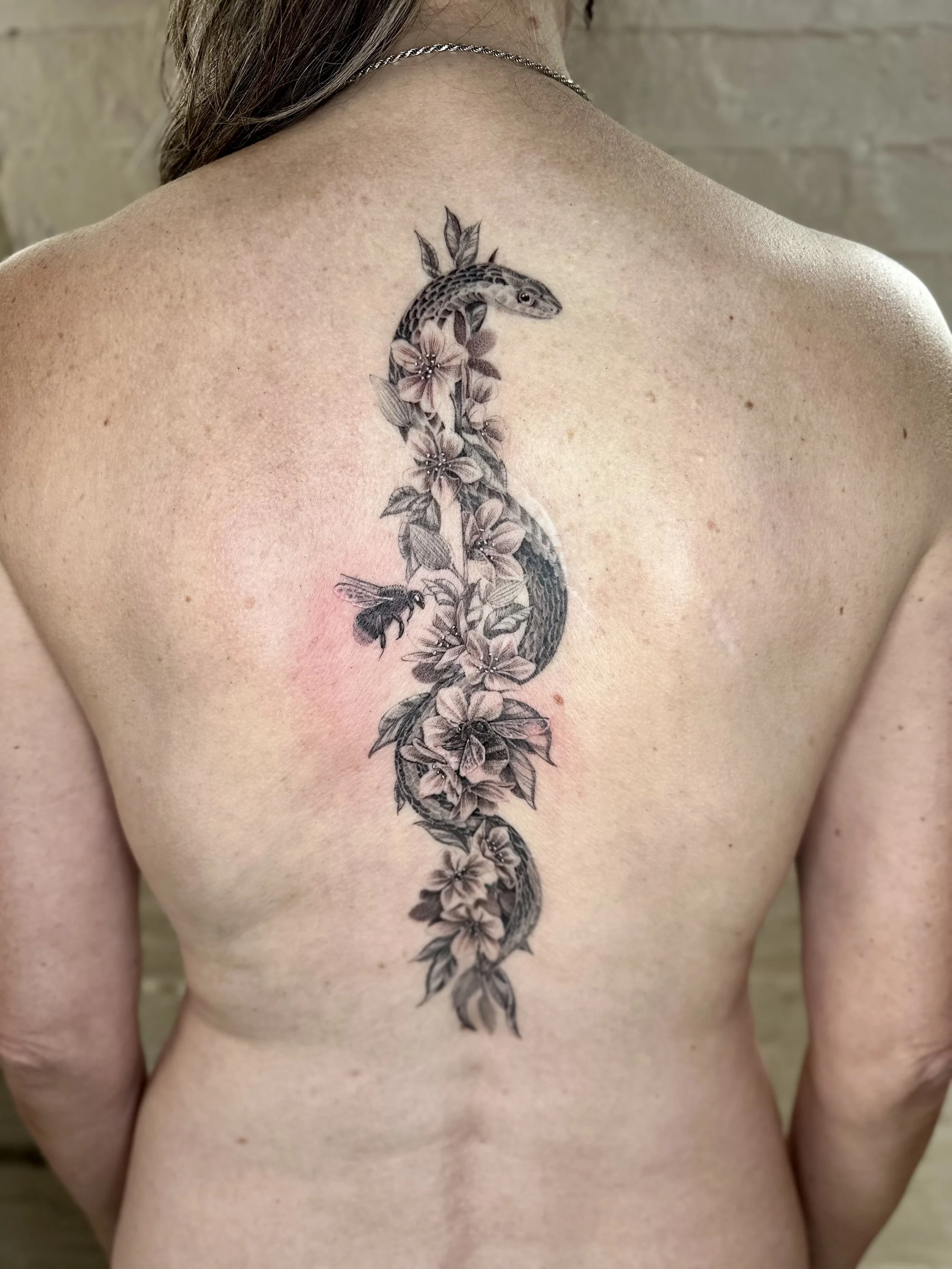 Fine Line Medical Symbol Tattoo with Garter Snake and Almond Branch