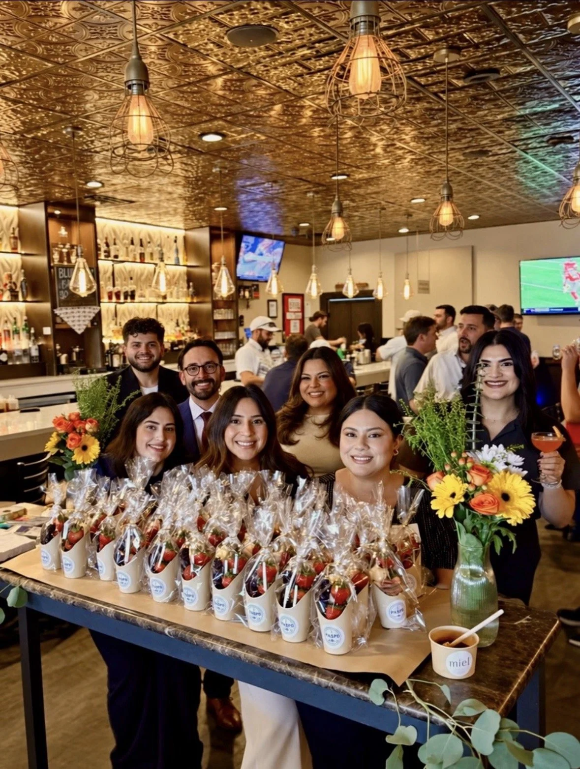 Group photo of attendees with the charcuterie table!