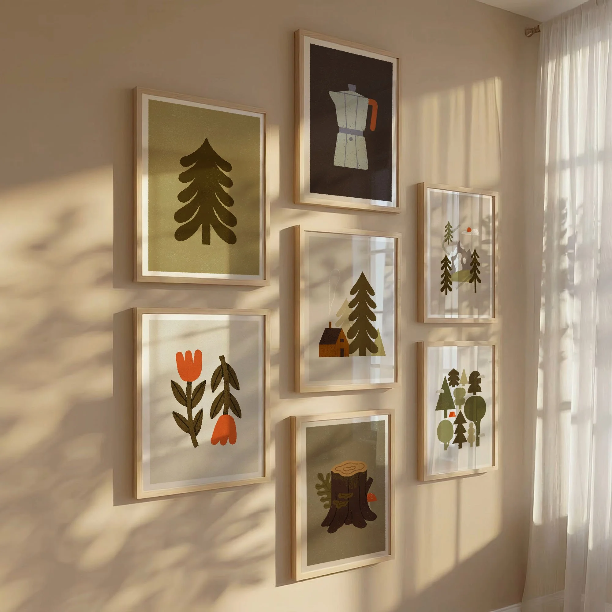 Nature-inspired gallery wall featuring forest, mountain, and cabin prints.