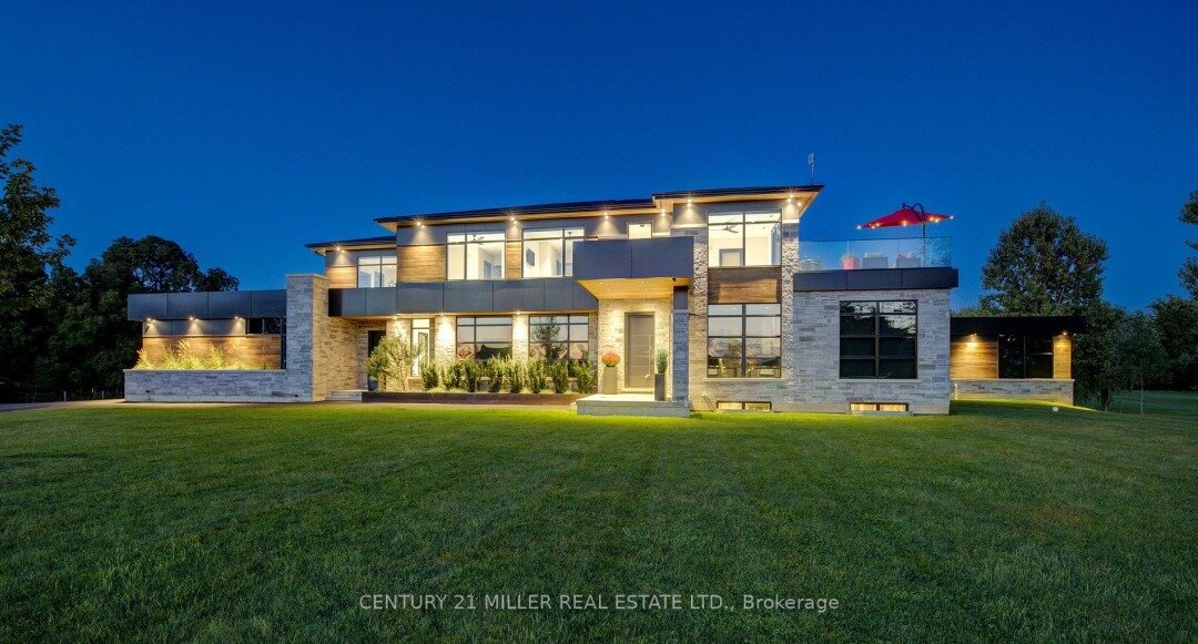 Warm, elegant, fresh and modern best describe this gorgeous custom built stone home in quiet pocket of similar homes, nestled into 3.685 acres, backing onto wooded area that provides privacy. A stunning masterpiece and design collaboration between An