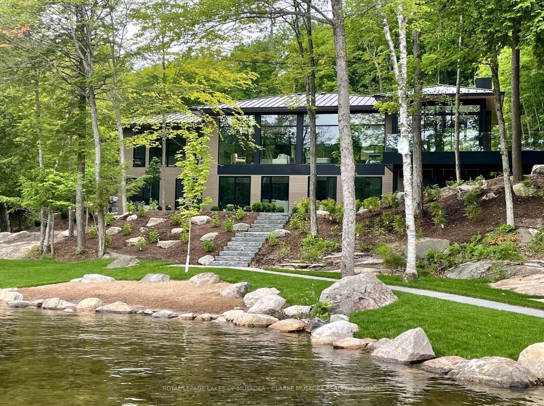 Introducing a stunning blend of modernity and comfort, this 5-bedroom, 4-bathroom sanctuary embraces an open concept design. Crafted with a bespoke combination of wood, MDF, and stone detailing, its allure is accentuated by floor-to-ceiling windows t