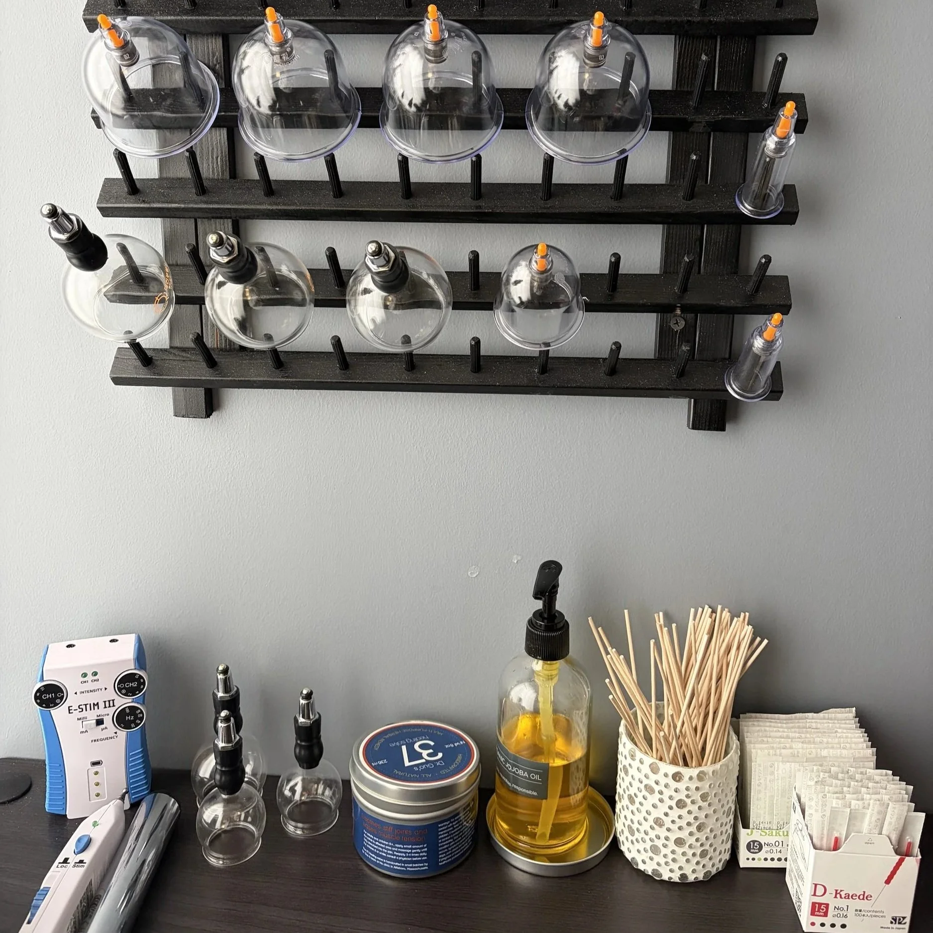 Cups, needles, and e-stim are some of the supplies we use during treatment