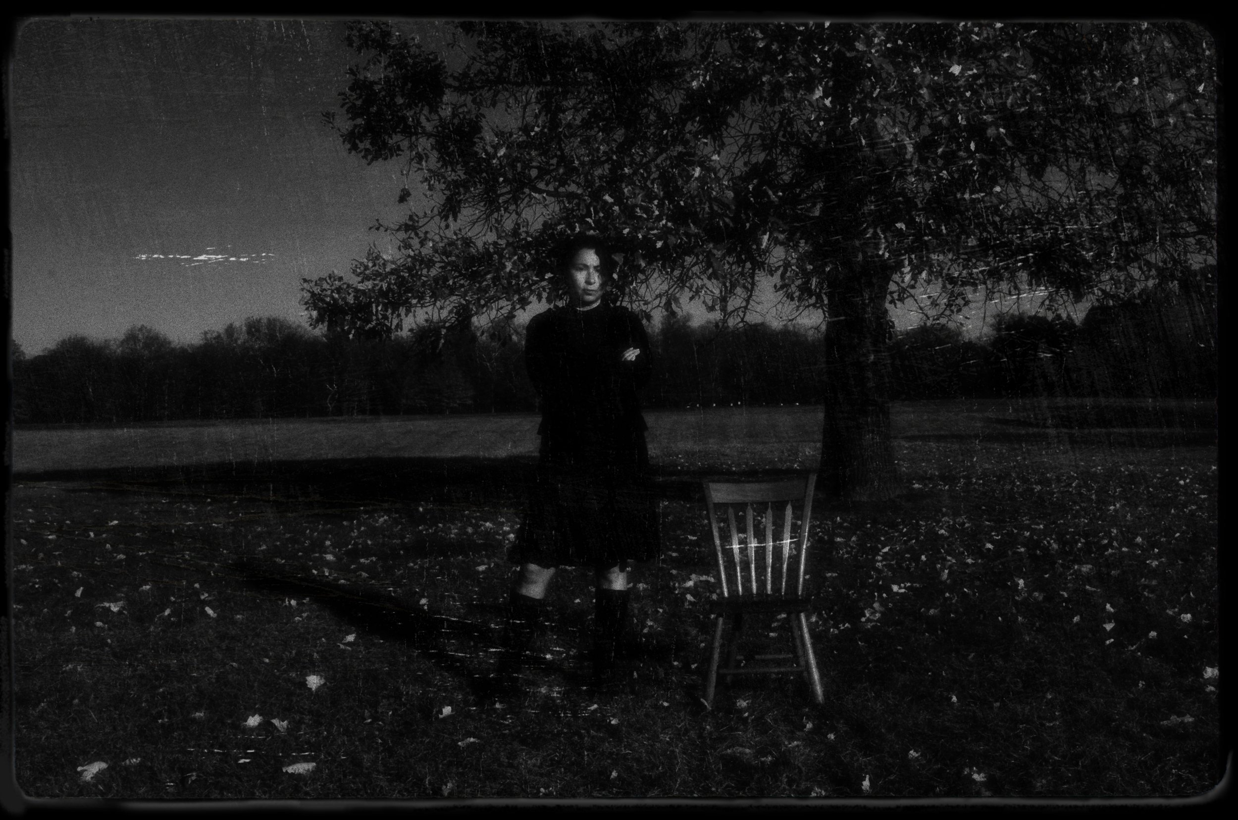 Woman With Arms Folded at Sunset