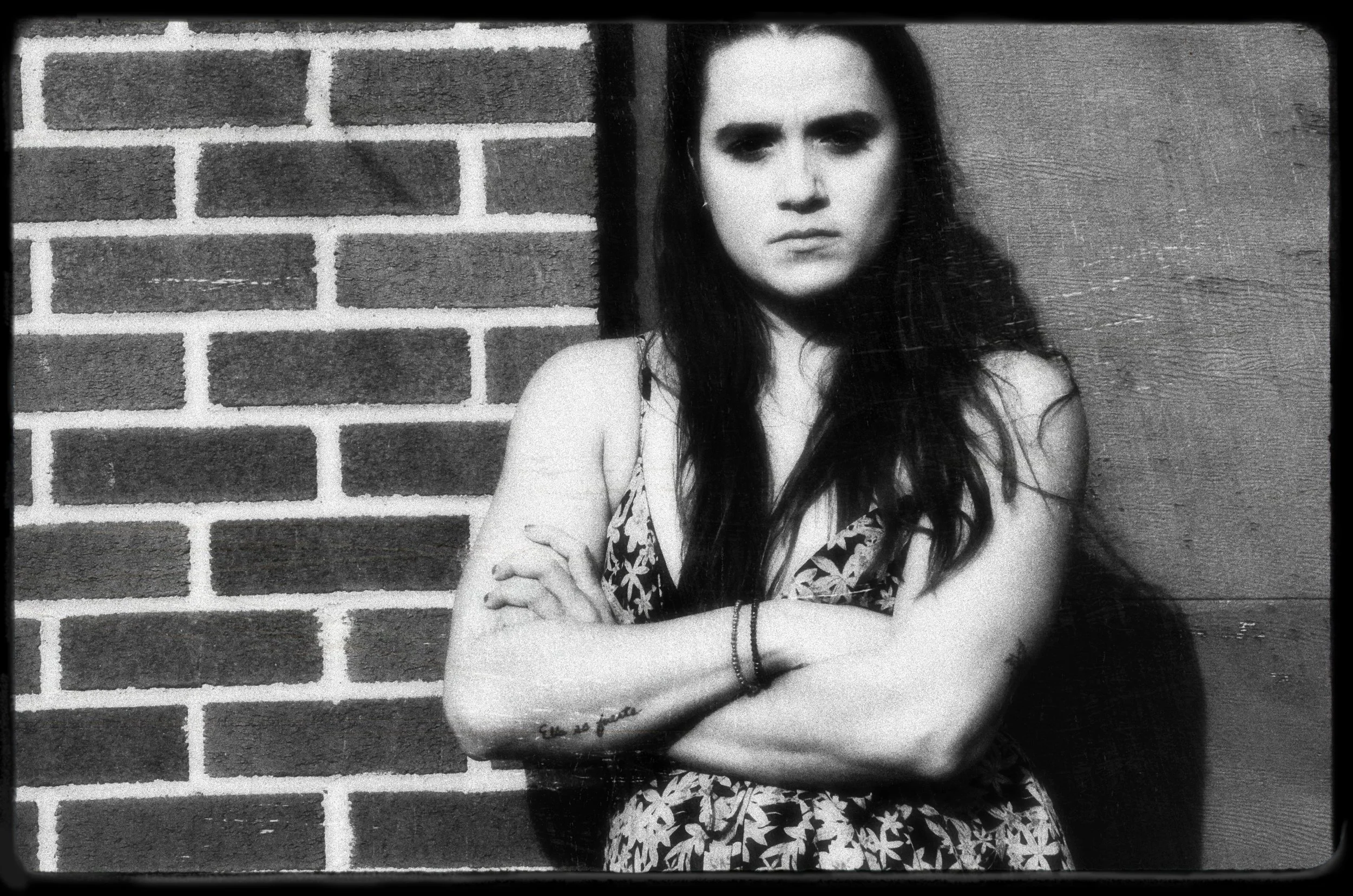 Woman Against Brick