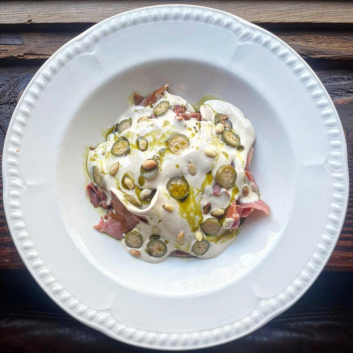 Ox tongue in tonnato sauce, caper berries, parsley oil, pine nuts