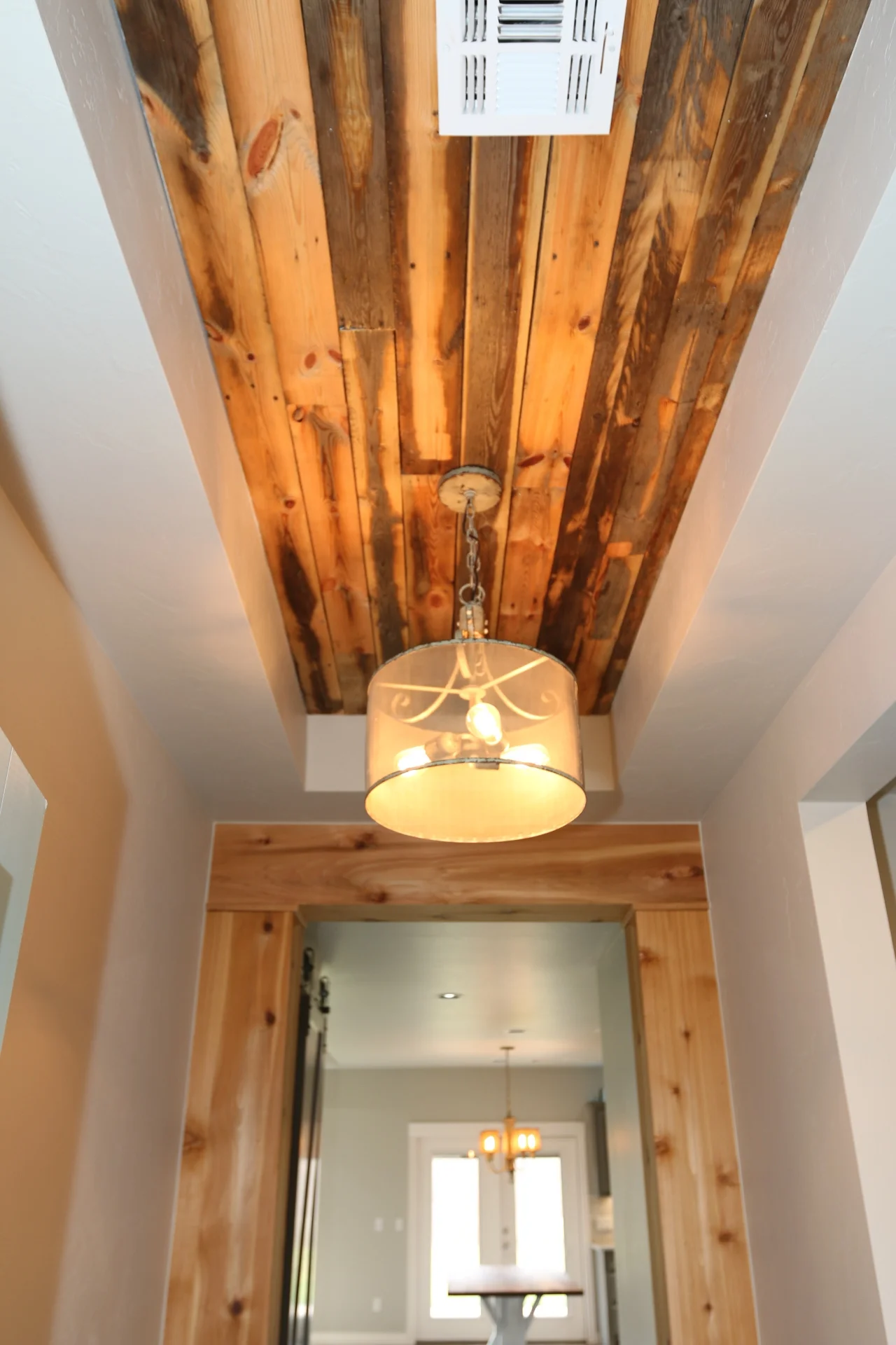 reclaimed wood walls and ceiling with chandelier.jpeg
