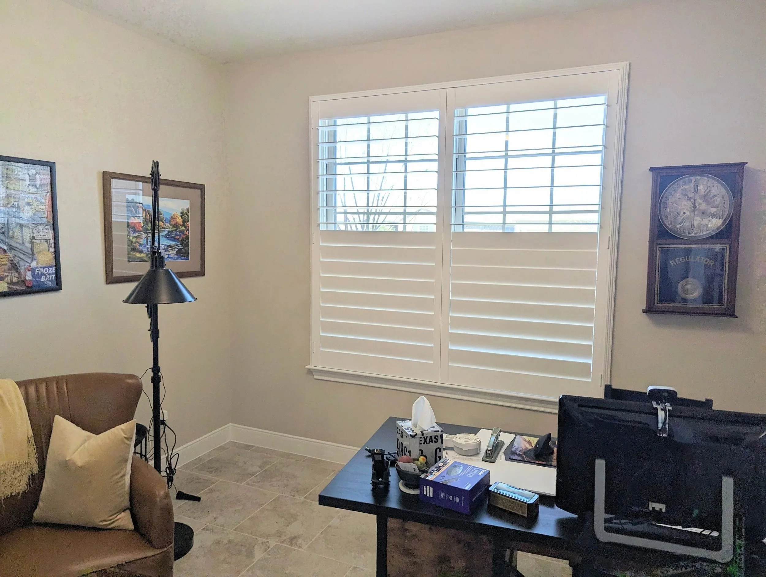 Plantation shutters with 4.5-inch louvers, hidden rear tilt, 50/50 split tilt, and a Deco frame in a home office.