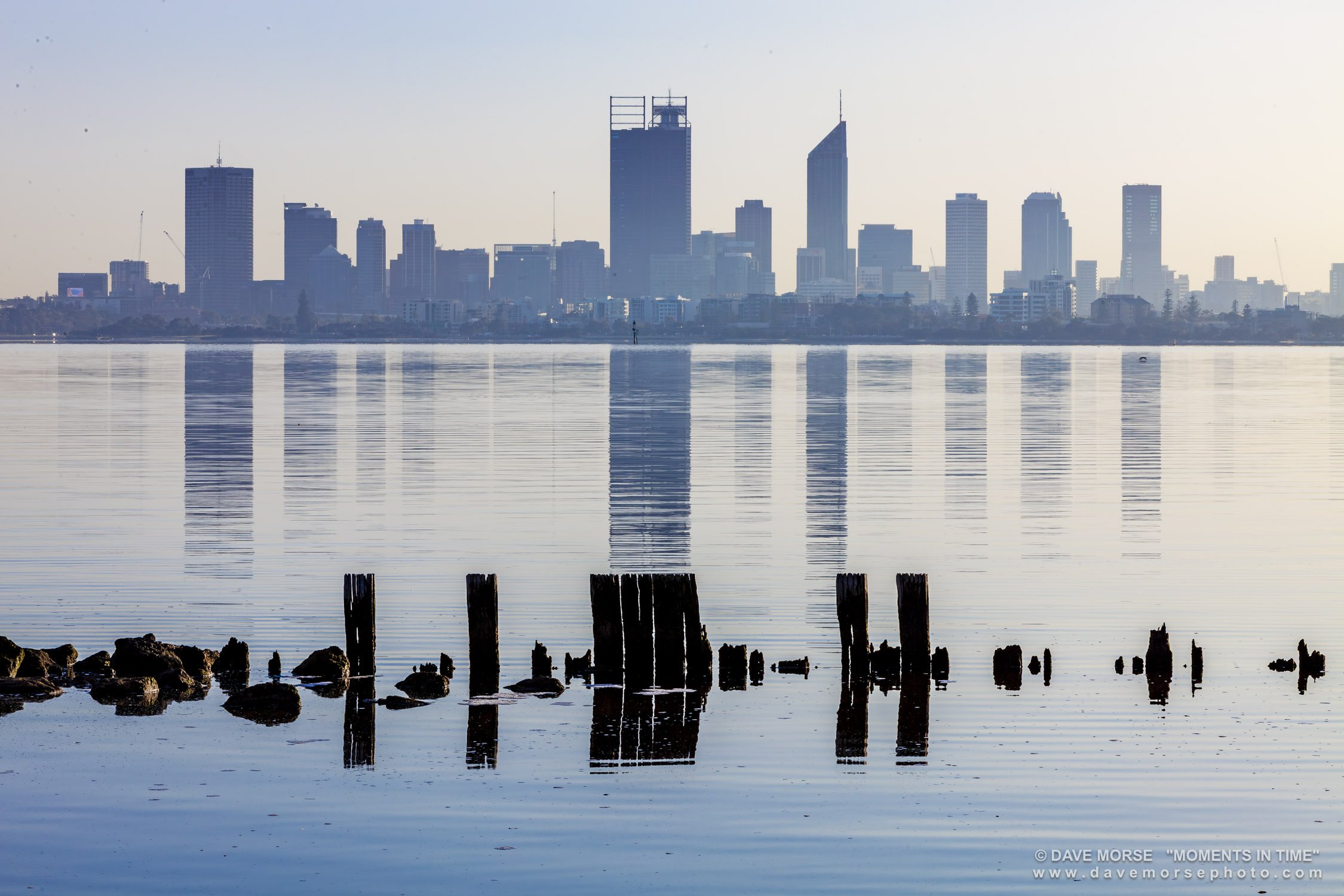 Applecross. Image No. A2679.12815.32 ... One of those magic mornings, stumps from the old retaining wall/jetty which incidentally have now all disappeared due to storms, making for an interesting Photo, named "Barcodes". 12/8/2015.