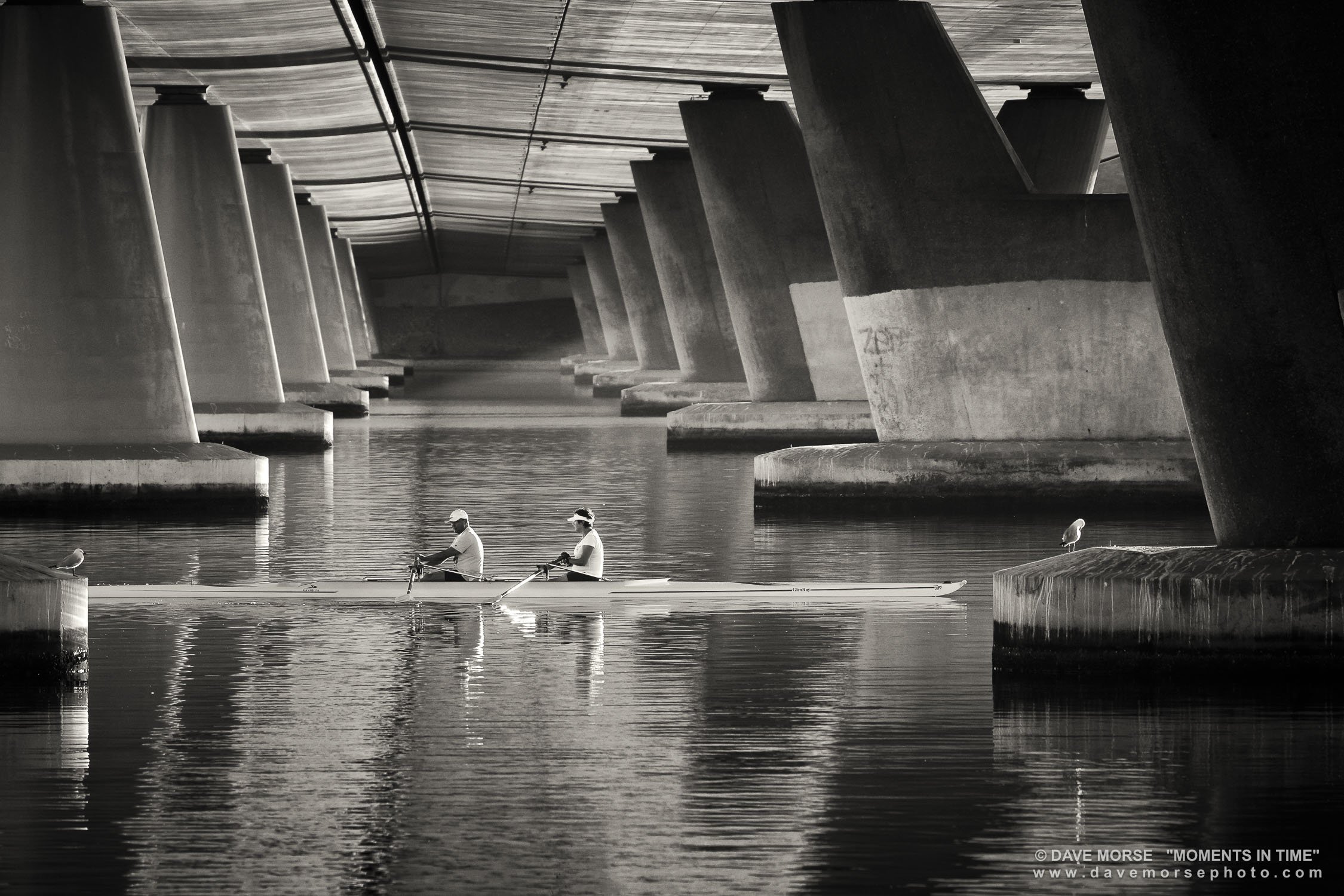 Bridges. Image No. A1424.71117.32 ... Early morning rowers captured through the pylons of Mt. Henry Bridge. 7/11/2017.