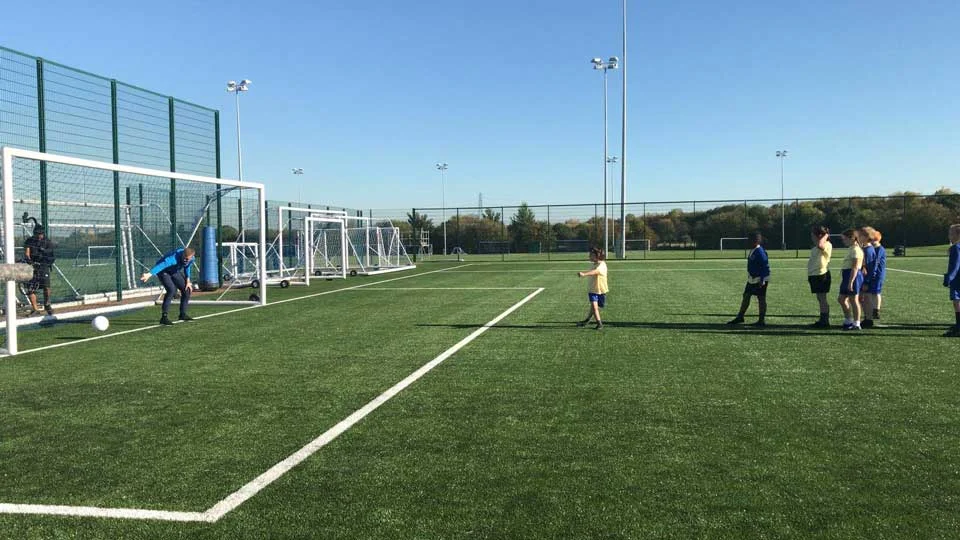 One of the kids takes a shot at Everton and England’s number one.