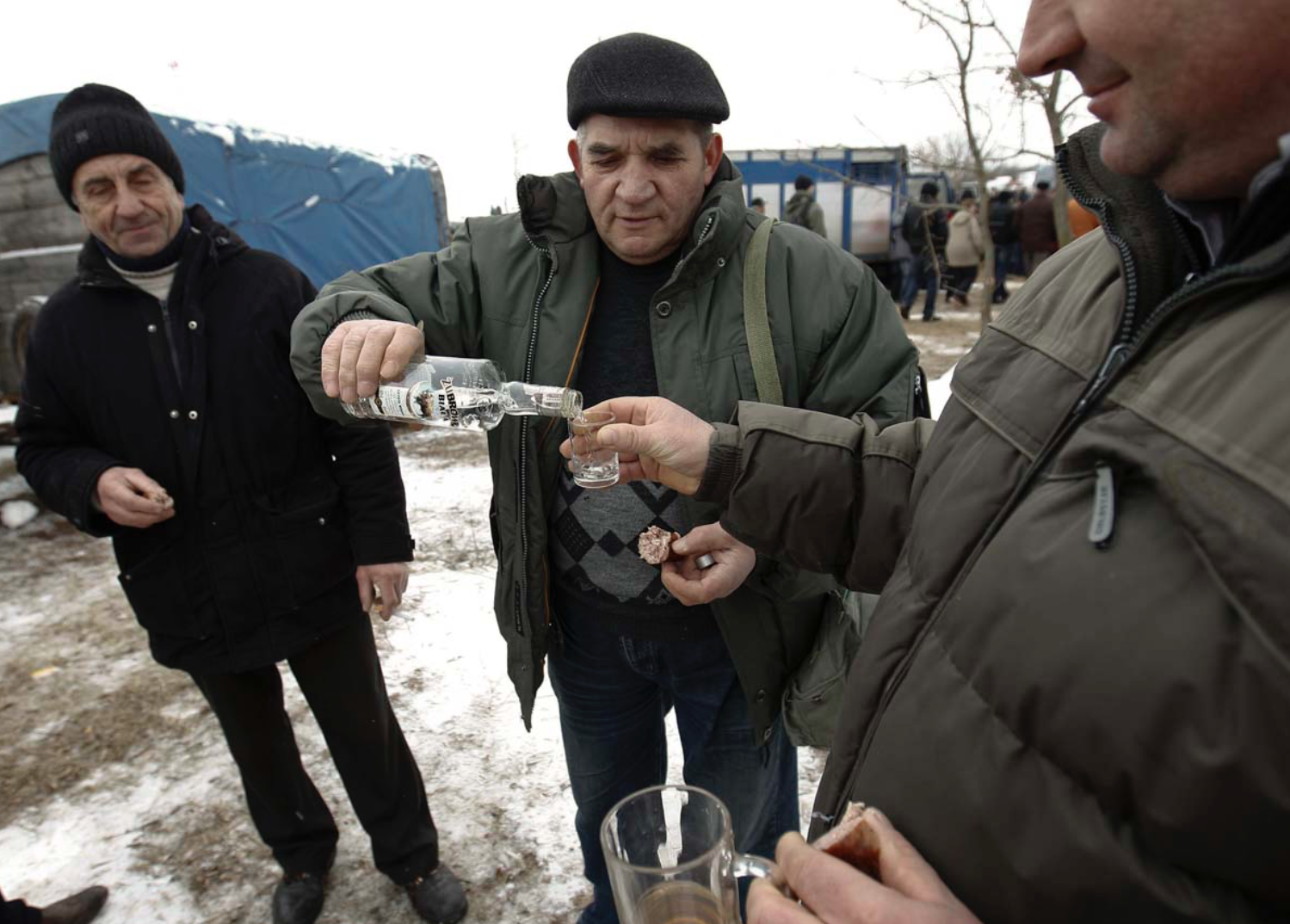 Horse traders drink Polish vodka at Skaryszew horse fair. (Peter Andrews/Reuters)