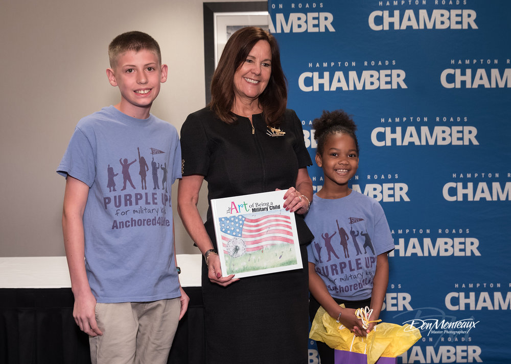 Karen Pence with military children presenting her with a gift.