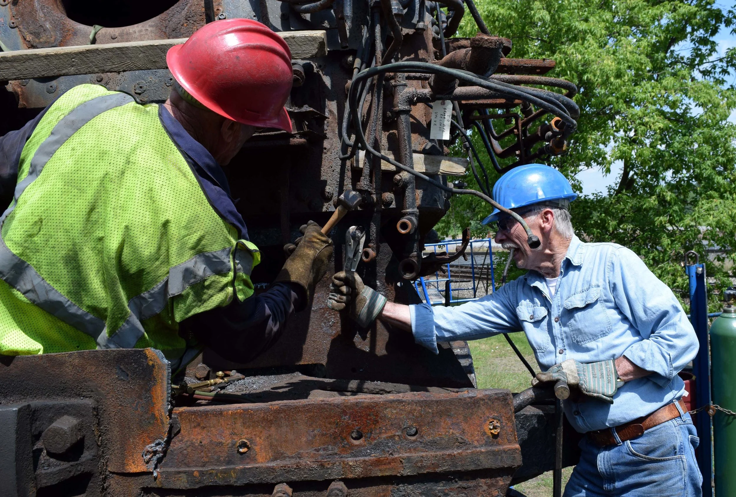 Myron and Coll burning bearer plate bolts.JPG