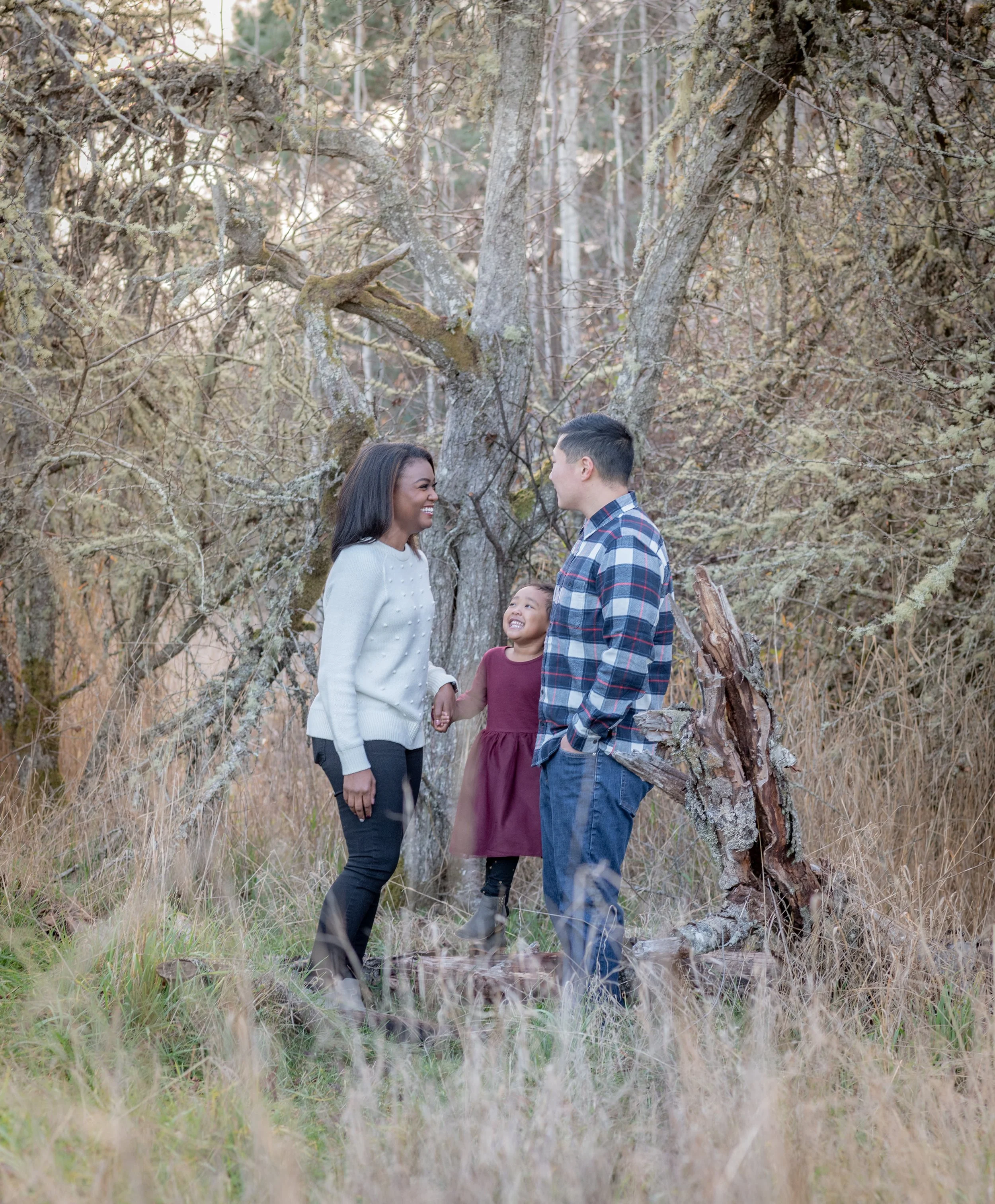 Family session in the woods in Lakewood, WA including a little girl with her parents