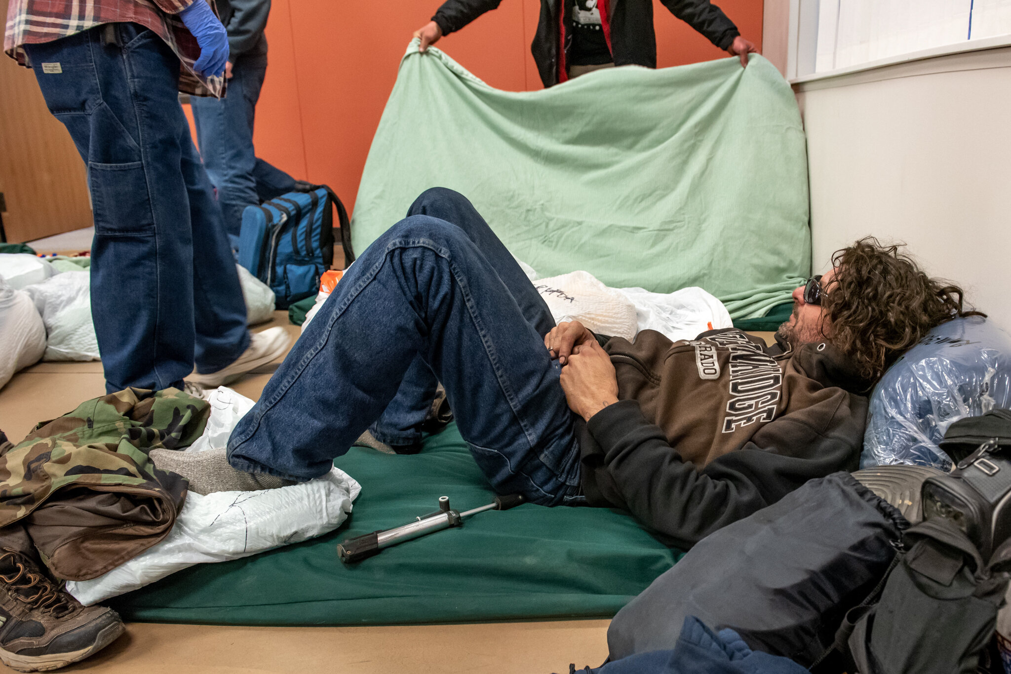  Russell Wilson relaxes on a sleeping mat at The Journey on Tuesday, February 25, 2020.  The Journey is one of two Longmont churches that provide overnight shelter for people experiencing homelessness, or HOPE. (Valerie Mosley/Special to the Colorado