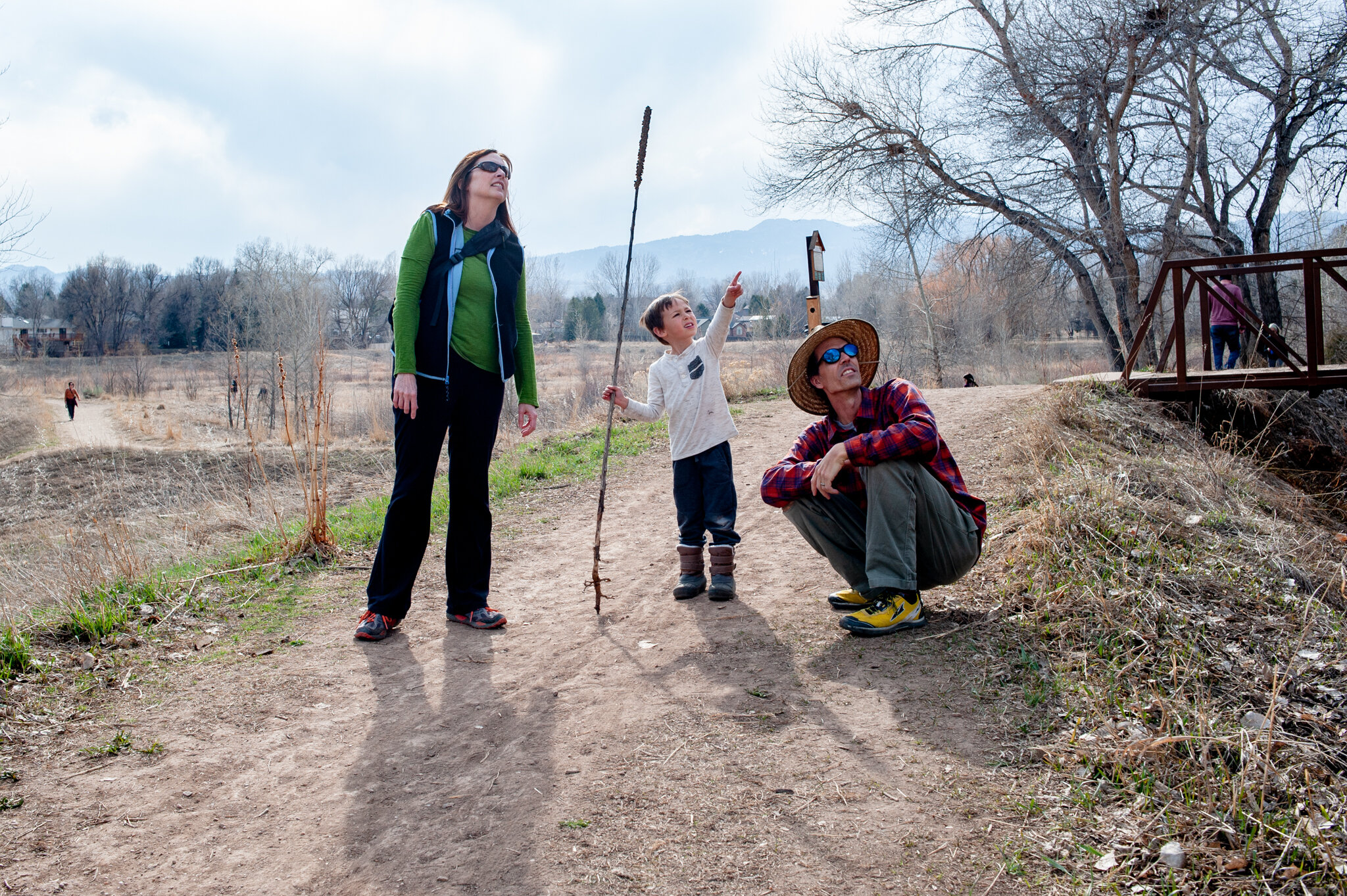  Cindy Kroeger, Brian Kraus and their son Oliver Kraus, 6, look at a bird in Red Fox Meadows Natural Area in Fort Collins on Wednesday, March 18, 2020. Kroeger said that other than cancelling their spring break trip to Missouri, things have seemed pr