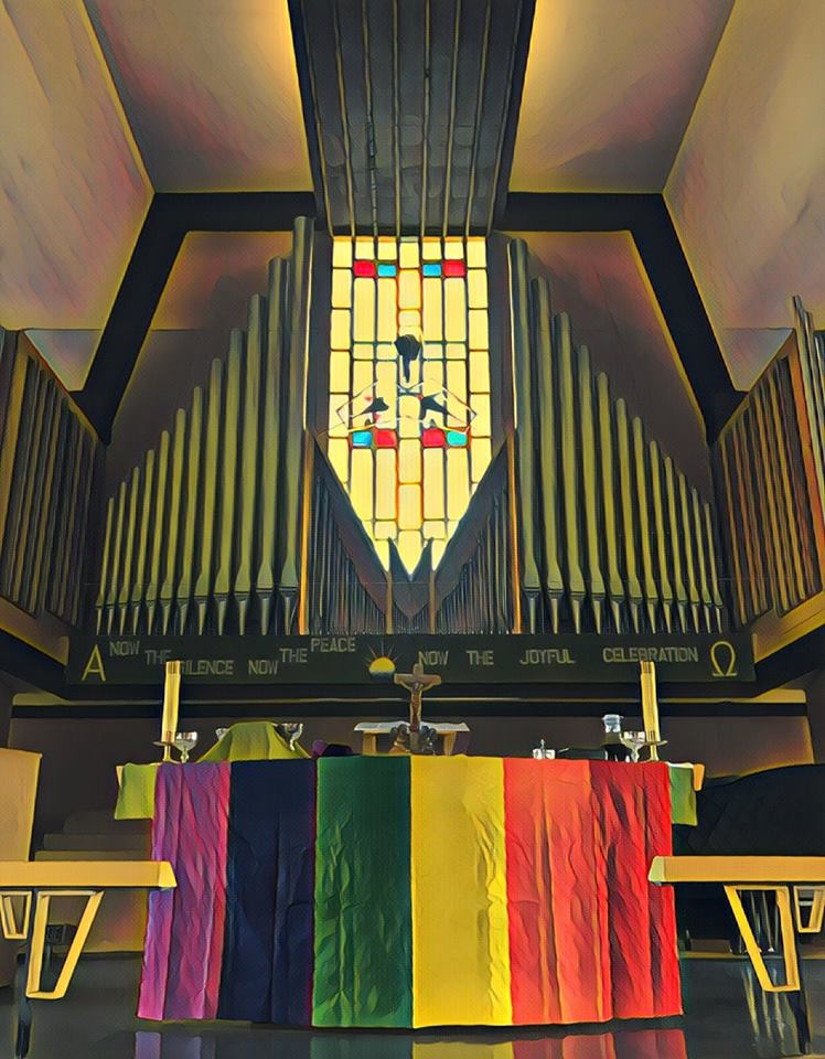 rainbow flag on altar in sanctuary.jpg