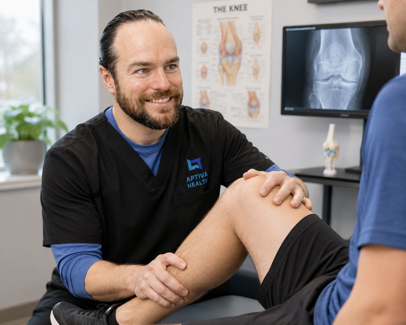 Dr. Robert Williams of Aptiva Health performing a knee injury evaluation during a sports medicine appointment.