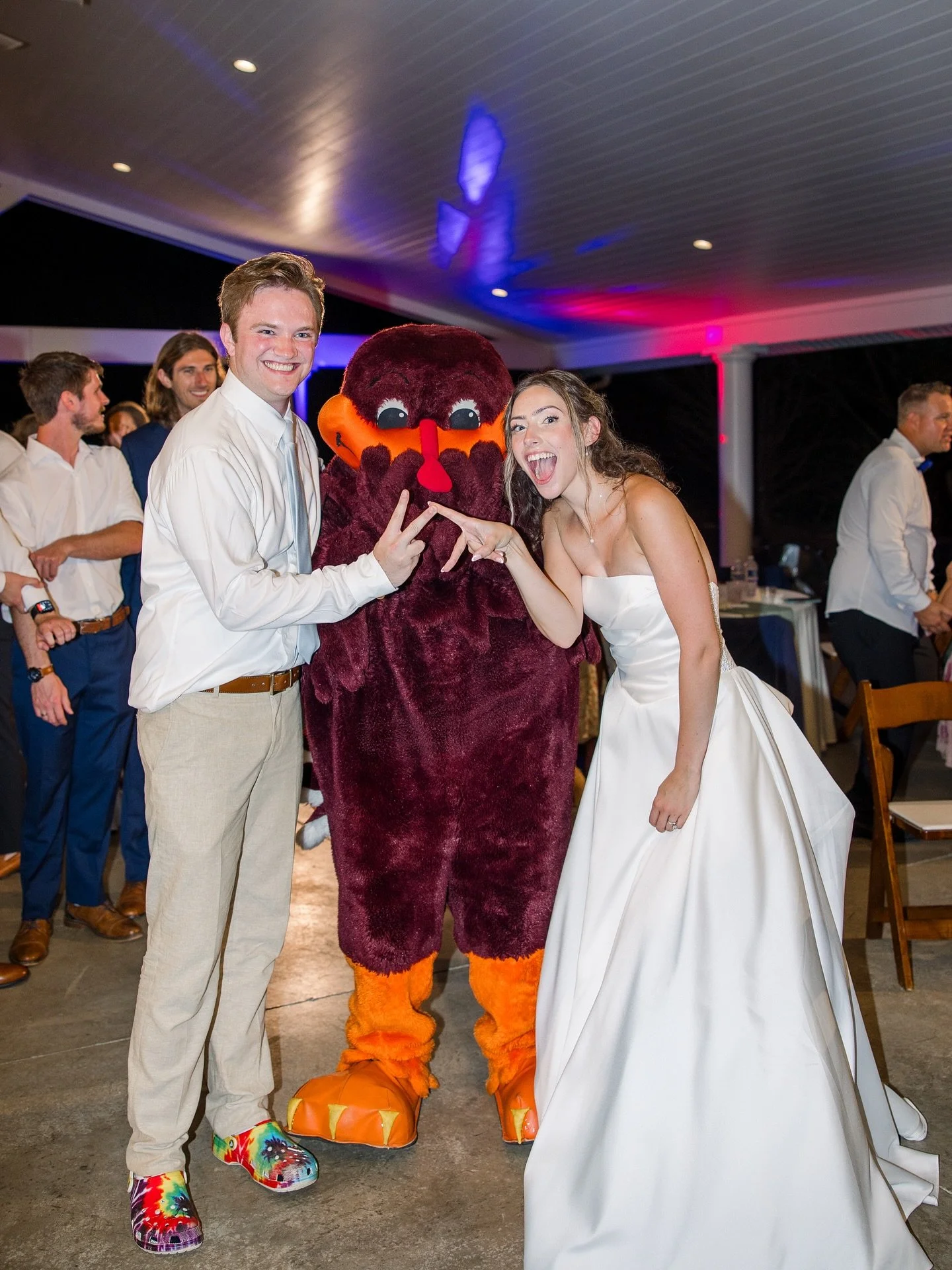 POV: You invited the HokieBird to your wedding&hellip; and he understood the assignment 🧡🧡
&bull;
&bull;
📸 @katelynworkmanphotography 
@virginia.tech 
#weddingfun #weddingsurprise #vawedding #hokiebird #hokies #hokiebird