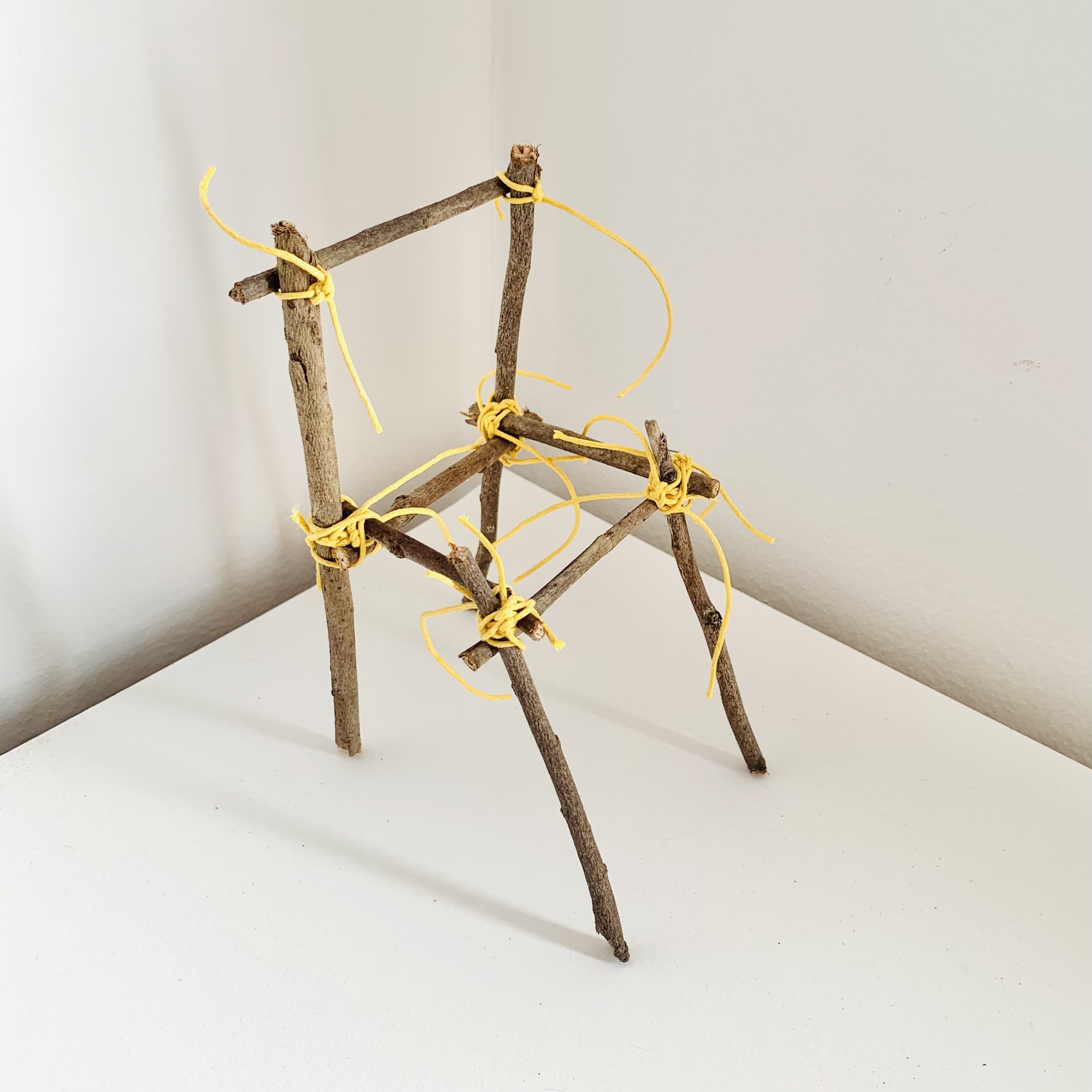  Kavanayén. Silla / Chair. 2025  Tree branches, a leave and cord 9 × 12 in 23 × 30 cm 