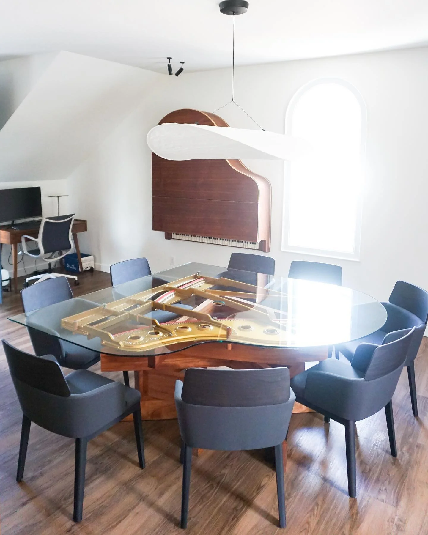 Mission complete: One baby grand piano gets a second (and third) life. CRESCENDO, and it&rsquo;s meeting table counterpart VIBRATO, delivered and installed. The cast iron harp pulled from the 1885 Gerhard Heintzman now sits atop a modern, geometric, 