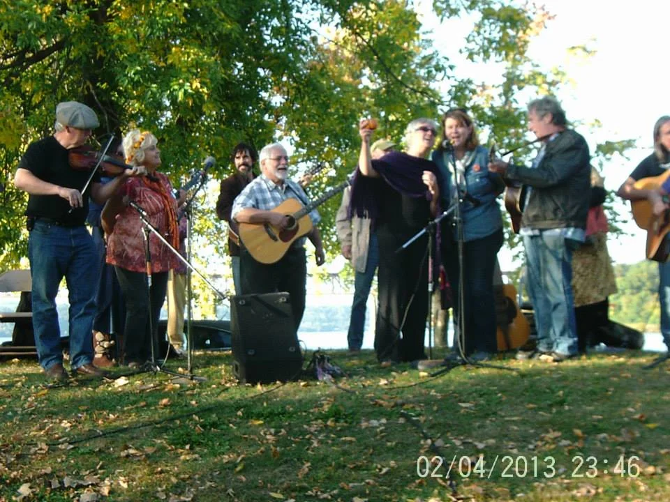 Singing on the hill with friends at Pete and Toshi Seeger Memorial Park, Hudson River, Beacon NY.