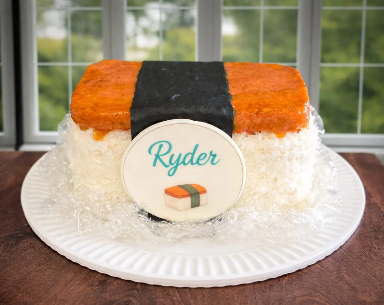Custom Spam Musubi cake designed to look like Hawaiian spam musubi with rice texture, seaweed band, glossy spam topping, and personalized name plaque