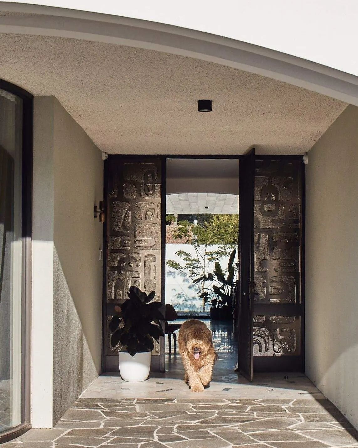 The bridge house entry. 
Custom bronze glazing flanking the entry, blending new and old. 

@basisbuilders 
@peterbbennetts 
@toucanforgedglass 
@acre_studio
@formlandscaping

#caulfieldmodern 
#renovation 
#melbournearchitecture 
#augie 
#crazypaving