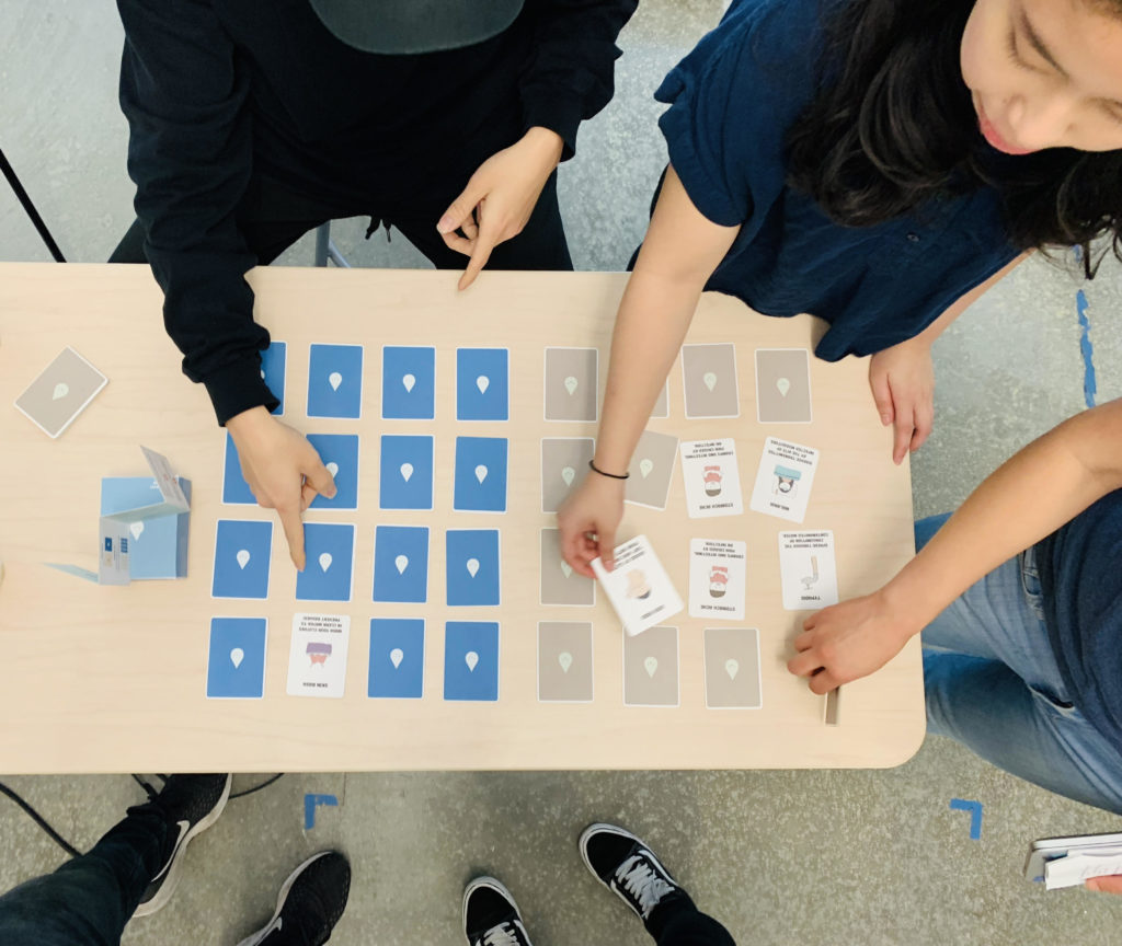 Our team playing the card game with visitors at Jacob’s Institute for Design Innovation’s Spring 2019 Showcase!