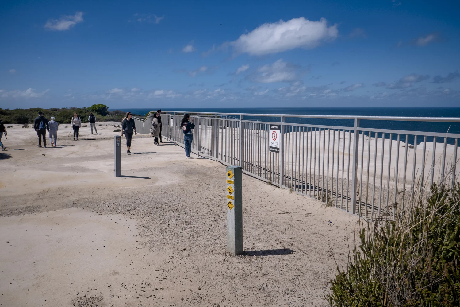 The scale of the fence is incredible in an effort to keep visitors from climbing the fence. Most visitors are content to stay behind the fence and take their images.