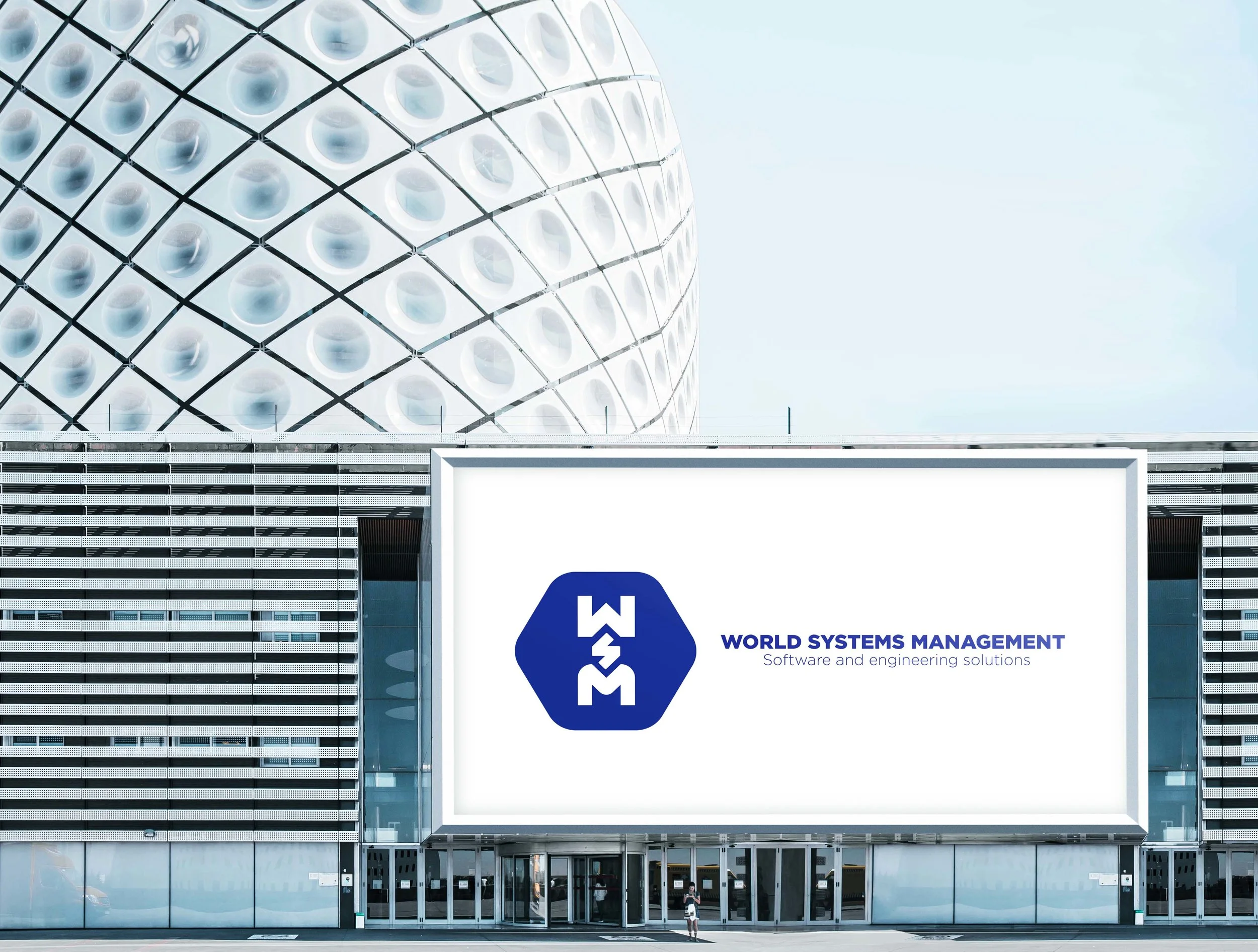 WSM logo on a large billboard on a modern building.