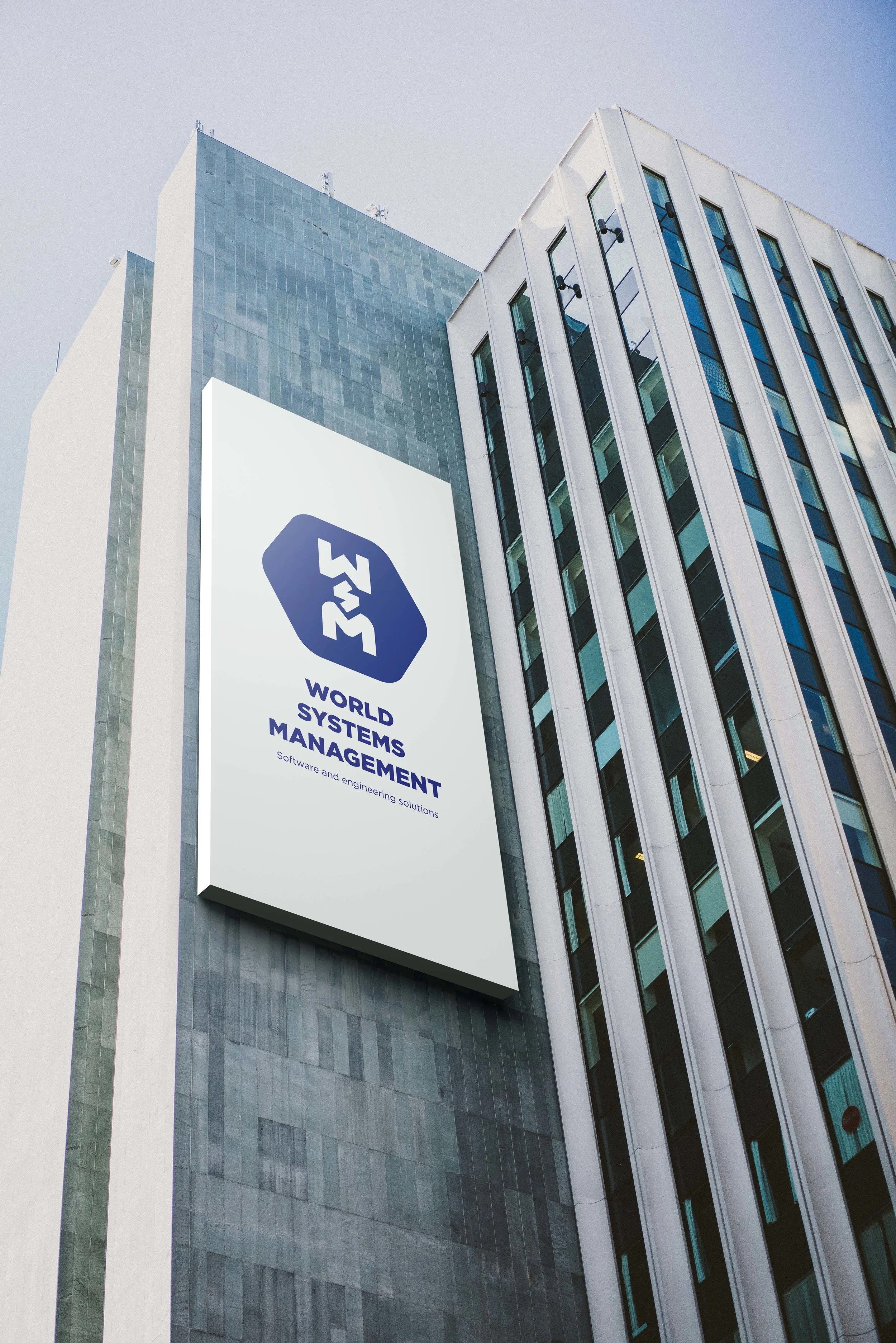 Vertical WSM banner on the side of an office tower.