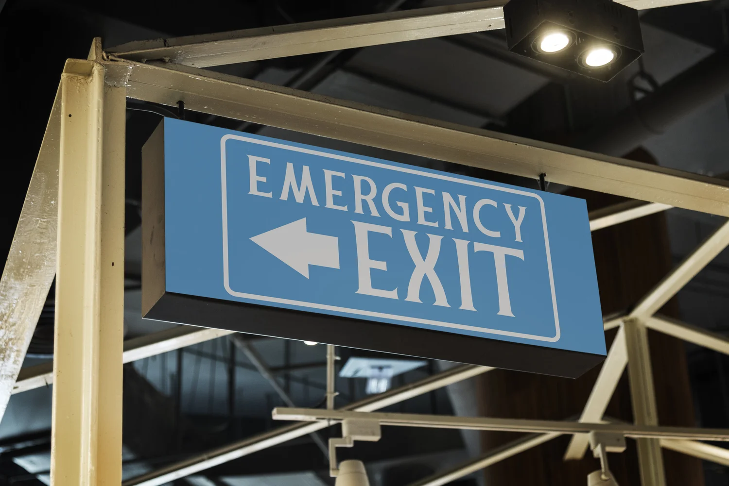 Blue Emergency Exit sign with an arrow.
