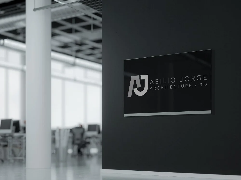 Abilio Jorge logo on a dark wall sign in a bright office.