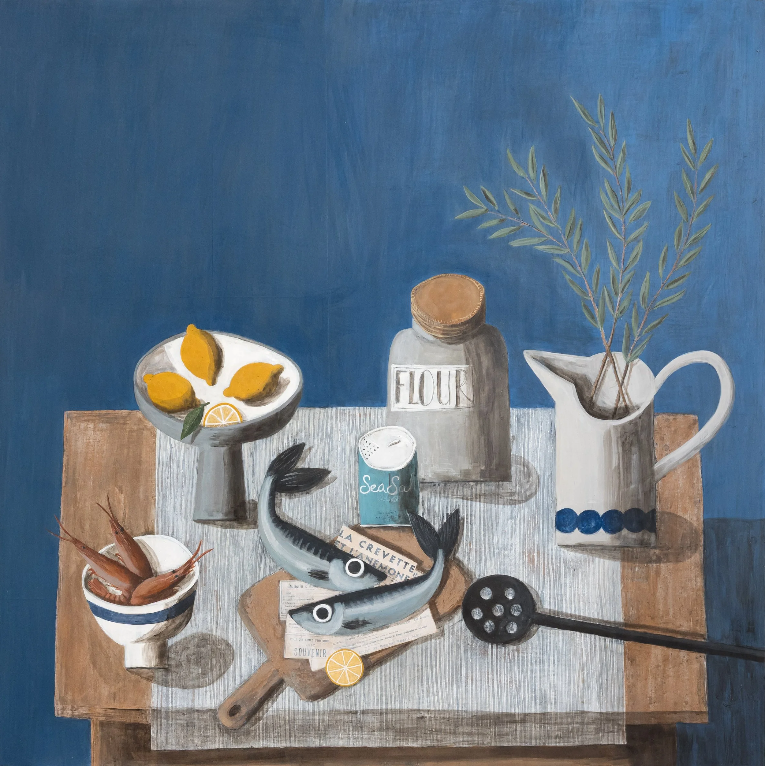 A large table of lemons, olive branches, sea salt, fish and langoustines before supper, on a deep blue ground. Mixed media still life painting on panel by Astrid Trügg.