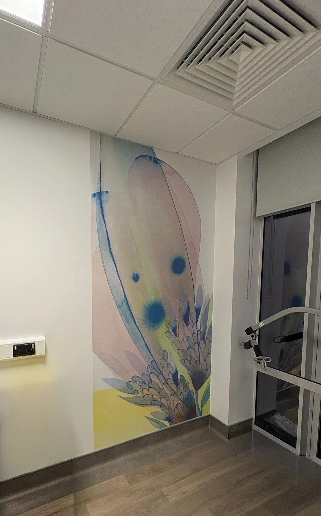 Image of a large leafy watercolour on a corner wall in the Bon Secour Hospital Limerick Ireland, by visual artist Tracy Sweeney