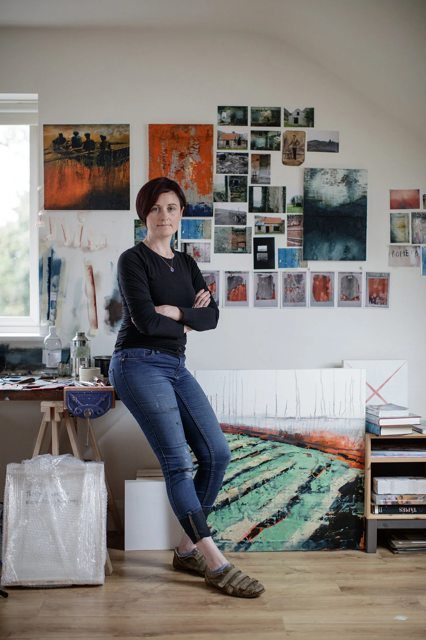 Tracy Sweeney in her studio, working as a contemporary abstract painter