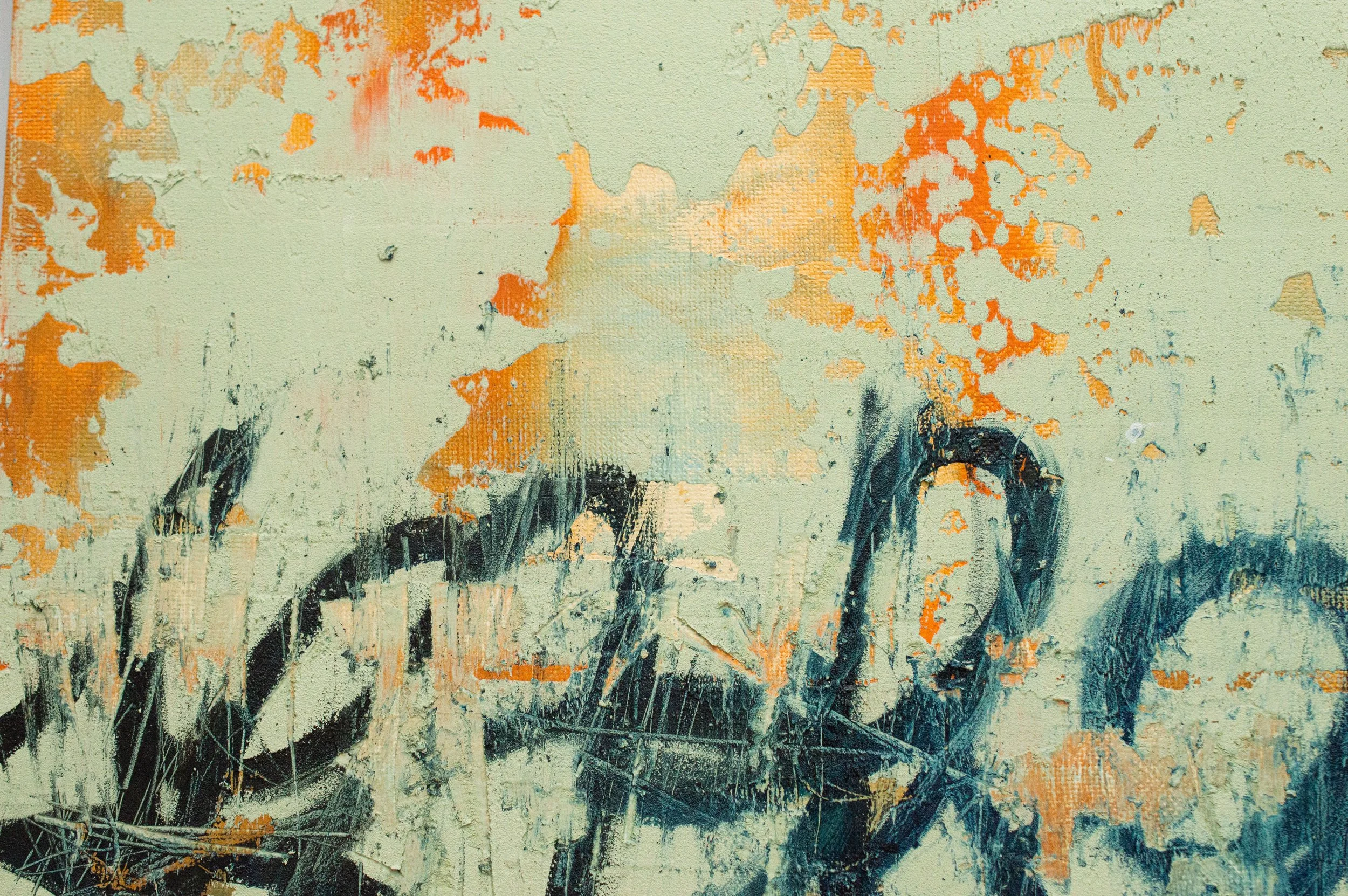 Close-up of an Irish abstract painting with textured surface, featuring greenish background with orange patches and black brushstrokes, resembling graffiti marks or an abstract autobiographical signature.