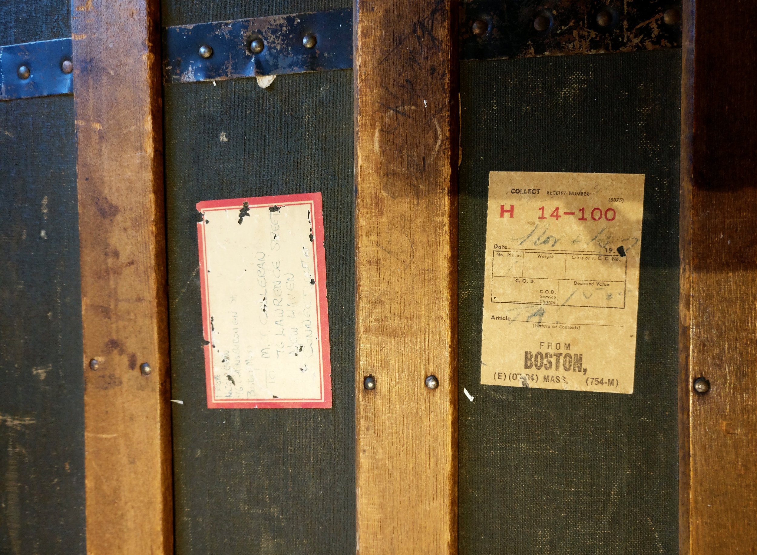 Close-up of Nancy’s trunk, bearing the traces of her journey from Ireland to America.