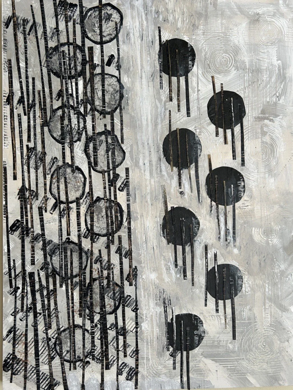   Carla Cascio  works on multi media collages that incorporate paper, fabric, inks and acrylic paints. Her mixed media on board displays black and white patterns, creating the illusion of musical notes. 