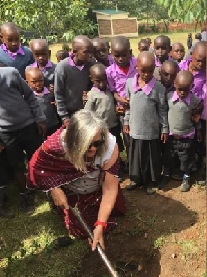 Anne planting a seedling at the Nailepu Academy