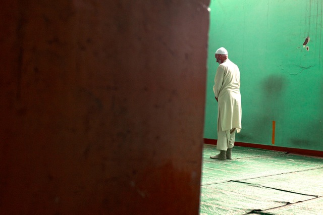 © Katarina Premfors - Prayer at Batmaloo Bus Station - Kashmir, India 2009