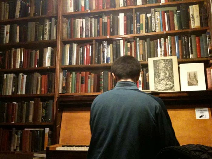 © Hind Mezaina - Inside Shakespeare and Company in the reading room. Yes, someone actually played on the piano. I wanted to hug him. But I didn't...